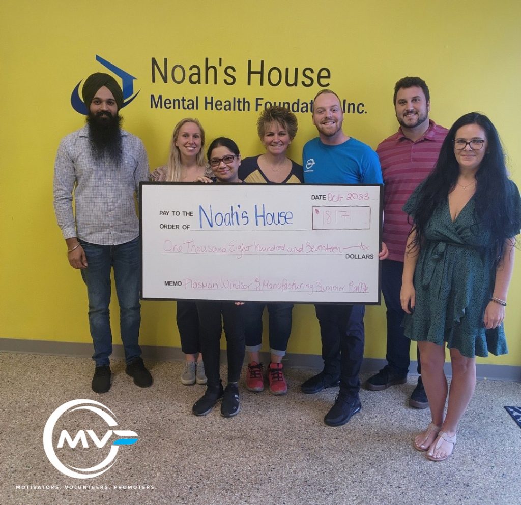 Plasman employees holding cheque for Noah's House for 17