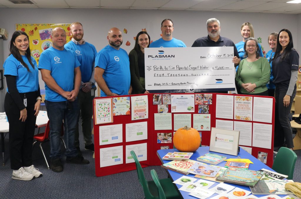 Plasman MVP ambassadors standing with Ready Set Go representatives holding a big cheque in the amount of $4,000