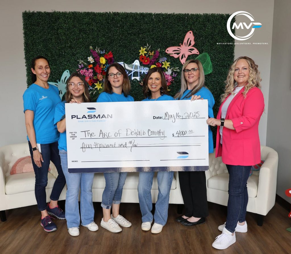 5 Plasman MVPs holding a cheque for $4,000 with Executive Director Ali Rogers of The Arc in the foyer of the Arc.