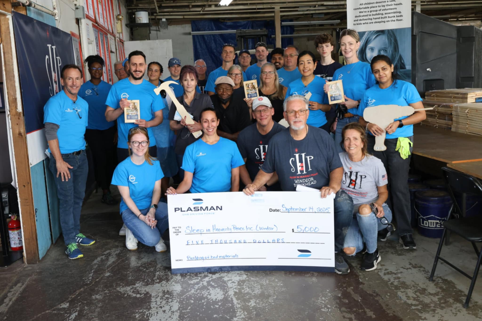 Sleep in Heavenly Peace Plasman MVP donation of large cheque