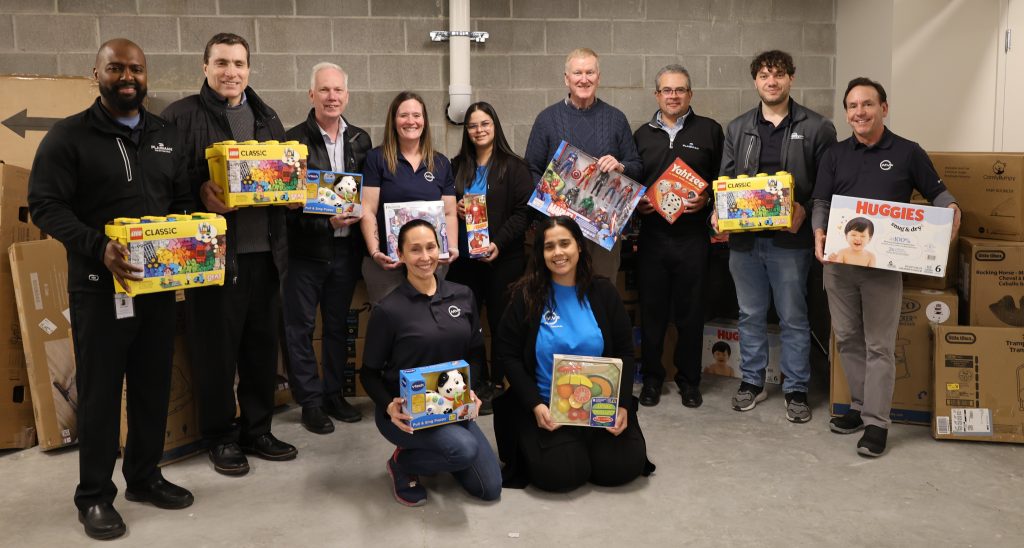 Plasman group holding items donated