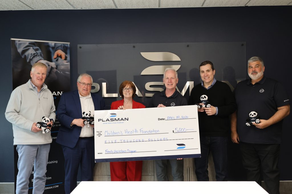 Senior Executive Team at Plasman standing with the Philathropy team of London's Health Foundation holding a big cheque stating $5,000