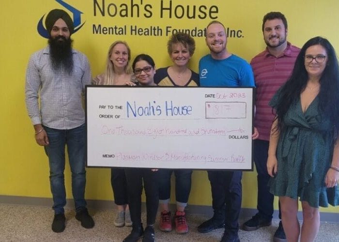 Plasman employees holding cheque for Noah's House for $1817